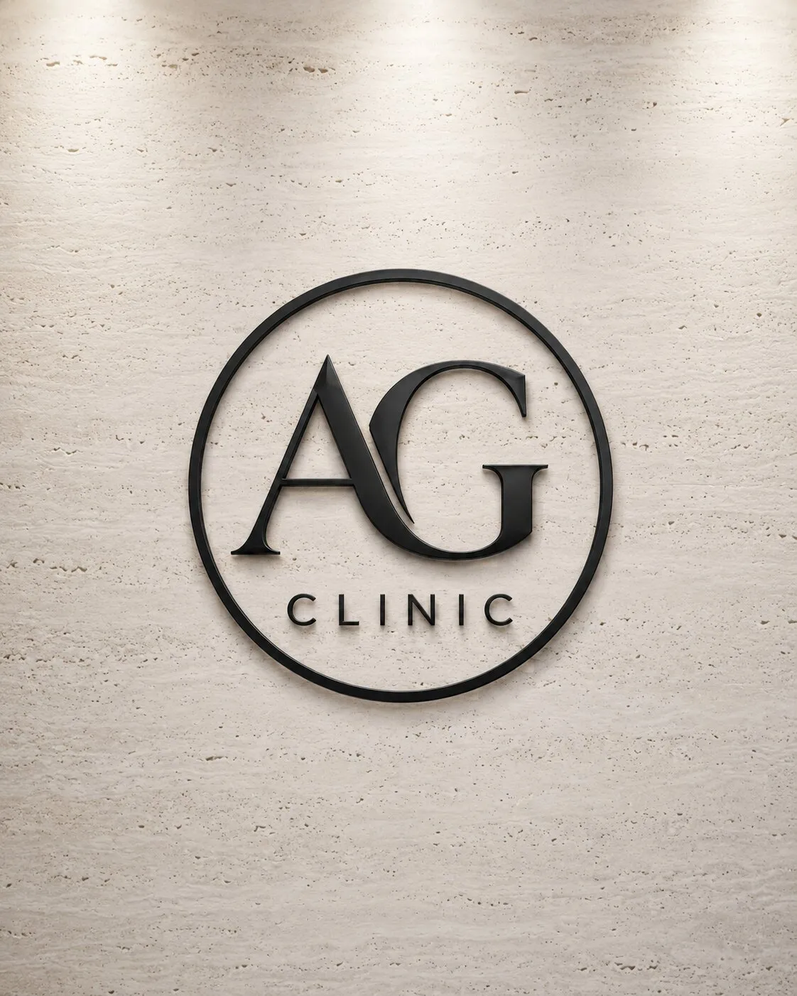 AG Clinic logo mounted on a travertine wall